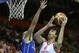Czech Republic's Lubos Barton, left, tries to block Croatia's Dario Saric, right, during their EuroBasket European Basketball Championship Group C match in Celje, Slovenia, Monday, Sept. 9, 2013. (AP Photo/Petr David Josek)
