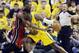 Indiana Pacers center Roy Hibbert (55) drives against Miami Heat center Chris Bosh during the first half of Game 1 of the Eastern Conference finals NBA basketball playoff series, Sunday, May 18, 2014, in Indianapolis. (AP Photo/Darron Cummings)