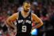 PORTLAND, OR - MAY 12: Tony Parker #9 of the San Antonio Spurs glares over at the bench in the second half of Game Four of the Western Conference Semifinals against the Portland Trail Blazers during the 2014 NBA Playoffs at the Moda Center on May 12, 2014 in Portland, Oregon. The Blazers won the game 103-92. NOTE TO USER: User expressly acknowledges and agrees that, by downloading and or using this photograph, User is consenting to the terms and conditions of the Getty Images License Agreement. (Photo by Steve Dykes/Getty Images)