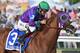 BALTIMORE, MD - MAY 17: California Chrome #3, ridden by Victor Espinoza, races to the finishline to win the 139th running of the Preakness Stakes at Pimlico Race Course on May 17, 2014 in Baltimore, Maryland. (Photo by Molly Riley/Getty Images)
