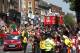 Arsenal's soccer team players parade through the street of London Sunday, May 18, 2014, aboard an open top bus in celebration of their English FA Cup win. Aaron Ramsey scored in extra time to clinch a 3-2 victory over Hull on Saturday, making Arsenal FA Cup Winners for the fifth time in Arsene Wenger's 14-year tenure as coach of The Gunners.(AP Photo/Sang Tan)