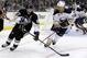 Pittsburgh Penguins' Sidney Crosby (87) and Buffalo Sabres center Cody Hodgson (19) skate during the second period of a NHL hockey game in Pittsburgh Saturday, Oct. 5, 2013. The Penguins won 4-1. (AP Photo/Gene J. Puskar)
