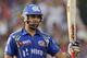 Mumbai Indians' Rohit Sharma raises his bat after scoring fifty runs during an Indian Premier League (IPL) cricket match against Kolkata Knight Riders in Kolkata, India, Saturday, May 12, 2012. (AP Photo/Bikas Das)