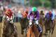 BALTIMORE, MD - MAY 17: California Chrome #3, ridden by Victor Espinoza, races with the field during the 139th running of the Preakness Stakes at Pimlico Race Course on May 17, 2014 in Baltimore, Maryland. (Photo by Matthew Stockman/Getty Images)
