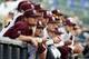 Mississippi State baseball players watch their team in the field as they play Southern Mississippi in the second inning of their NCAA college baseball game in Pearl, Miss., Tuesday, April 8, 2014. (AP Photo/Rogelio V. Solis)