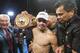 Juan Manuel Márquez, of Mexico, celebrates with championship belt after his victory over Mike Alvarado in the tenth round of a WBO welterweight title boxing match at the Forum in Inglewood, Calif., Saturday, May 17, 2014. (AP Photo/Ringo H.W. Chiu)