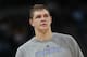 Denver Nuggets center Timofey Mozgov, of Russia, warms up before facing the Los Angeles Lakers in the third quarter of the Nuggets' 134-126 victory in an NBA basketball game in Denver on Friday, March 7, 2014. (AP Photo/David Zalubowski)