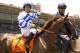 This photo provided by Benoit Photo shows jockey Victor Espinoza on Remarkable Moon at Santa Anita Park in Arcadia, Calif., Sunday, May 18, 2014. Espinoza rode California Chrome to victory in the Preakness Stakes in Baltimore on Saturday. (AP Photo/Benoit Photo)