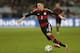 Germany's Mesut Oezil controls the ball during the international friendly soccer match between Germany and Chile in Stuttgart, Germany, Wednesday, March 5, 2014. (AP Photo/Matthias Schrader)