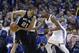 San Antonio Spurs forward Tim Duncan (21) keeps the ball fro Oklahoma City Thunder forward Kevin Durant (35) during an NBA basketball game in Oklahoma City, Thursday, April 4, 2013. (AP Photo/Sue Ogrocki)