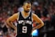 PORTLAND, OR - MAY 12: Tony Parker #9 of the San Antonio Spurs glares over at the bench in the second half of Game Four of the Western Conference Semifinals against the Portland Trail Blazers during the 2014 NBA Playoffs at the Moda Center on May 12, 2014 in Portland, Oregon. The Blazers won the game 103-92. NOTE TO USER: User expressly acknowledges and agrees that, by downloading and or using this photograph, User is consenting to the terms and conditions of the Getty Images License Agreement. (Photo by Steve Dykes/Getty Images)