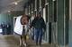Groom Raul Rodriguez walks Kentucky Derby and Preakness Stakes winner California Chrome around a barn at Pimlico Race Course in Baltimore, Monday, May 19, 2014. California Chrome is scheduled to depart Tuesday for Belmont Park, N.Y. The Belmont Stakes horse race takes place June 7. (AP Photo/Patrick Semansky)