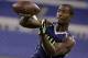 Pittsburg State wide receiver John Brown makes a catch as he runs a runs a drill at the NFL football scouting combine in Indianapolis, Sunday, Feb. 23, 2014. (AP Photo/Michael Conroy)