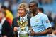 MANCHESTER, ENGLAND - MAY 11: The Manchester City Manager Manuel Pellegrini and Yaya Toure pose with the trophy at the end of the Barclays Premier League match between Manchester City and West Ham United at the Etihad Stadium on May 11, 2014 in Manchester, England. (Photo by Shaun Botterill/Getty Images)