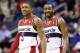 Washington Wizards guard Bradley Beal (3) and Washington Wizards guard John Wall (2) smile in the second half of an NBA basketball game against the Portland Trail Blazers, Monday, Feb. 3, 2014, in Washington. The Wizards won 100-90. (AP Photo/Alex Brandon)