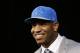 Detroit Lions NFL football first-round draft choice, 10th overall, North Carolina tight end Eric Ebron smiles during a news conference in Allen Park, Mich., Friday, May 9, 2014. (AP Photo/Paul Sancya)