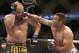 Fabricio Werdum, right, and Travis Browne fight during a UFC mixed martial arts bout on Saturday, April 19, 2014, in Orlando, Fla. Werdum won. (AP Photo/Reinhold Matay)