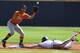 Vanderbilt's Xavier Turner beats the throw to Tennessee's Nick Senzel (13) as he slides into second base during the Southeastern Conference NCAA college baseball tournament on Tuesday, May 20, 2014, in Hoover, Ala. (AP Photo/Butch Dill)