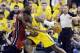 Indiana Pacers center Roy Hibbert (55) drives against Miami Heat center Chris Bosh during the first half of Game 1 of the Eastern Conference finals NBA basketball playoff series, Sunday, May 18, 2014, in Indianapolis. (AP Photo/Darron Cummings)