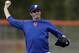 FILE - In this Feb. 22, 2014 file photo, New York Mets pitcher Matt Harvey plays catch during spring training baseball practice in Port St. Lucie, Fla. The Mets and Harvey have agreed where the pitcher will rehabilitate from elbow ligament-replacement surgery. General manager Sandy Alderson said Tuesday, March 25, 2014, the right-hander will be with the club in New York during homestands and work at the team's spring training complex in Port St. Lucie when the Mets are on the road. (AP Photo/Jeff Roberson, File)