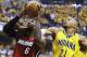 Indiana Pacers forward David West (21) tries to stop a shot by Miami Heat forward LeBron James (6) during the first half of Game 1 of the Eastern Conference finals NBA basketball playoff series Sunday, May 18, 2014, in Indianapolis. (AP Photo/Darron Cummings)
