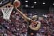 Oklahoma State guard Markel Brown sails to the basket for a score against Gonzaga during the second half in a second-round game in the NCAA college basketball tournament Friday, March 21, 2014, in San Diego. (AP Photo/Denis Poroy)