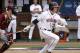 Virginia's Derek Fisher (23) hits the ball during the NCAA regional college game against Elon in Charlottesville, Va., Sunday June 2, 2013. Virginia defeated Elon 11-3. (AP Photo/Andrew Shurtleff)