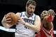 Feb 10, 2014; Minneapolis, MN, USA; Minnesota Timberwolves forward Kevin Love (42) grabs a rebound over Houston Rockets center Dwight Howard (12) during the second quarter at Target Center. Mandatory Credit: Brace Hemmelgarn-USA TODAY Sports
