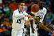 BUFFALO, NY - MARCH 22: Ryan Arcidiacono #15 of the Villanova Wildcats passes the ball as Ryan Boatright #11 of the Connecticut Huskies defends during the third round of the 2014 NCAA Men's Basketball Tournament at the First Niagara Center on March 22, 2014 in Buffalo, New York. (Photo by Elsa/Getty Images)