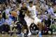 North Carolina's Isaiah Hicks (22) guards Oakland's Tommie McCune (23) during the first half of an NCAA college basketball game in Chapel Hill, N.C., Friday, Nov. 8, 2013. (AP Photo/Gerry Broome)