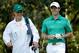AUGUSTA, GA - APRIL 09: Rory McIlroy of Northern Ireland alongside his caddie/girlfriend Caroline Wozniacki during the 2014 Par 3 Contest prior to the start of the 2014 Masters Tournament at Augusta National Golf Club on April 9, 2014 in Augusta, Georgia. (Photo by Ezra Shaw/Getty Images for Golfweek)
