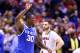INDIANAPOLIS, IN - MARCH 28: Julius Randle #30 of the Kentucky Wildcats celebrates defeating the Louisville Cardinals 74 to 69 during the regional semifinal of the 2014 NCAA Men's Basketball Tournament at Lucas Oil Stadium on March 28, 2014 in Indianapolis, Indiana. (Photo by Andy Lyons/Getty Images)