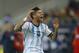 Argentina's Marcos Rojo reacts after receiving a blow to the head following a challenge by Romania's Alexandru Matel during an international friendly soccer game on the National Arena stadium in Bucharest, Romania, Wednesday, March 5, 2014.. (AP Photo/Vadim Ghirda)