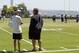 Oakland Raiders head coach Dennis Allen, left, talks to general manager Reggie McKenzie during NFL football practice in Alameda, Calif., Wednesday, June 13, 2012. (AP Photo/Marcio Jose Sanchez)