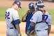 Florida coach Kevin O’Sullivan talks with pitcher Logan Shore, left, and catcher Taylor Gushue during the Southeastern Conference NCAA college baseball tournament game against Kentucky on Wednesday, May 21, 2014, in Hoover, Ala. (AP Photo/Hal Yeager)