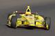 Helio Castroneves, of Brazil, drives through the first turn on the first day of qualifications for Indianapolis 500 IndyCar auto race at the Indianapolis Motor Speedway in Indianapolis, Saturday, May 17, 2014. (AP Photo/Dave Parker)