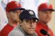 Philadelphia Phillies general manager Ruben Amaro Jr., center, speaks during a news conference as pitcher A.J. Burnett, left, and manager Ryne Sandberg, right, look on following a spring training baseball practice on Sunday, Feb. 16, 2014, in Clearwater, Fla. (AP Photo/Charlie Neibergall)