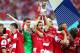 LONDON, ENGLAND - MAY 17: Mathieu Flamini of Arsenal leads the trophy celebrations after the FA Cup with Budweiser Final match between Arsenal and Hull City at Wembley Stadium on May 17, 2014 in London, England. (Photo by Clive Mason/Getty Images)