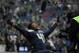 Seattle Seahawks cornerback Byron Maxwell yells as he is filmed while stretching before an NFL football game against the St. Louis Rams, Sunday, Dec. 29, 2013, in Seattle. (AP Photo/John Froschauer)