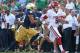 SOUTH BEND, IN - SEPTEMBER 28: Trevor Knight #9 of the Oklahoma Sooners runs for a first down chased by Matthias Farley #41 of the Notre Dame Fighting Irish at Notre Dame Stadium on September 28, 2013 in South Bend, Indiana. Oklahoma defeated Notre Dame 35-21. (Photo by Jonathan Daniel/Getty Images)