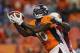 Denver Broncos wide receiver Gerell Robinson (10) catches a pass as Arizona Cardinals' Javier Arenas defends during the first quarter of a preseason NFL football game, Thursday, Aug. 29, 2013, in Denver. (AP Photo/Jack Dempsey)