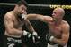 Josh Burkman, right, connects with a punch to Karo Parisyan during the second round of their welterweight bout, Saturday, May 26, 2007, at the MGM Grand Arena in Las Vegas. (AP Photo/Eric Jamison)
