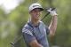 Dustin Johnson watches his tee shot on the 18th hole during the first round of the PGA Colonial golf tournament in Fort Worth, Texas, Thursday, May 22, 2014. (AP Photo/LM Otero)