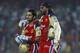 Chris Gayle, right, and Virat Kohli of Royal Challengers Bangalore walk back after their unbeaten 204 run second wicket partnership during their IPL cricket match against Delhi Daredevils, in New Delhi, India, Thursday, May 17, 2012. (AP Photo/ Saurabh Das)