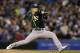 Oakland Athletics starting pitcher Sonny Gray throws against the Seattle Mariners in the sixth inning of a baseball game, Saturday, April 12, 2014, in Seattle. (AP Photo/Ted S. Warren)