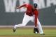 Boston Red Sox's Xander Bogaerts (2) fields the ball on a single by Baltimore Orioles' Adam Jones in the first inning of a baseball game in Boston, Friday, April 18, 2014. (AP Photo/Michael Dwyer)