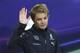 Mercedes driver Nico Rosberg, of Germany, waves as he arrives for a press conference in Monaco, Wednesday, May 21, 2014. The Monaco Formula One Grand Prix will be held on Sunday. (AP Photo/Antonio Calanni)