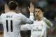 Real's Cristiano Ronaldo, right, celebrates with Real's Gareth Bale after scoring during a Champions League round of 16, second leg, soccer match between Real Madrid and Schalke 04 at the Santiago Bernabeu stadium in Madrid, Tuesday March 18, 2014. (AP Photo/Paul White)