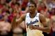 LAWRENCE, KS - JANUARY 18: Joel Embiid #21 of the Kansas Jayhawks reacts after scoring during the game against the Oklahoma State Cowboys at Allen Fieldhouse on January 18, 2014 in Lawrence, Kansas. (Photo by Jamie Squire/Getty Images)
