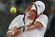 John Isner from the U.S. returns the ball during a Madrid Open tennis tournament match against David Ferrer from Spain in Madrid, Spain, Thursday, May 8, 2014. (AP Photo/Andres Kudacki)
